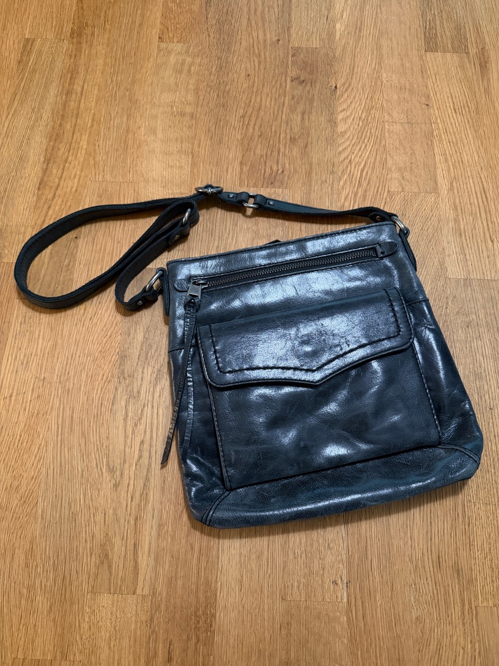 The Sak Black Leather Zip Top Crossbody Bag